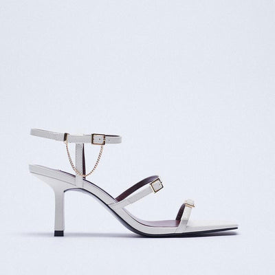 Beautiful White Three Step Stiletto Shoes, Three Strap, Buckle Closure, Square Toe, side view.