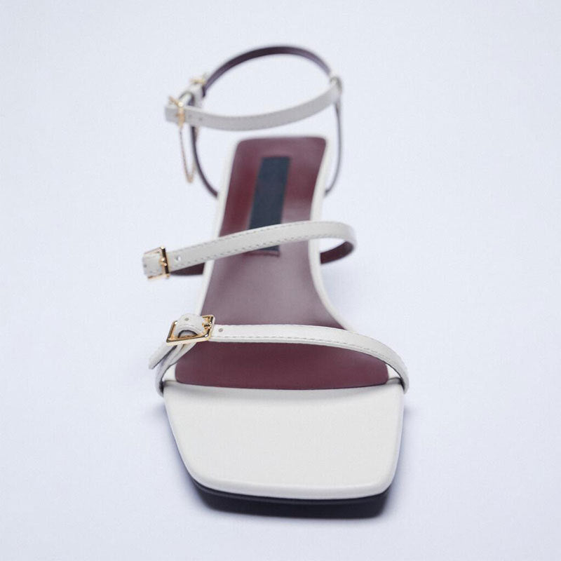 Beautiful White Three Step Stiletto Shoes, Three Strap, Buckle Closure, Square Toe, front view.